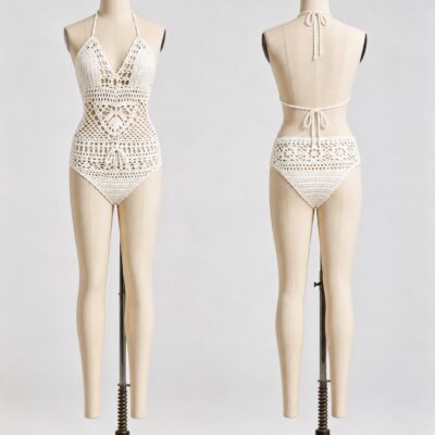 Front and back of an ivory crochet halter one-piece with floral openwork, V neckline and open back with ties