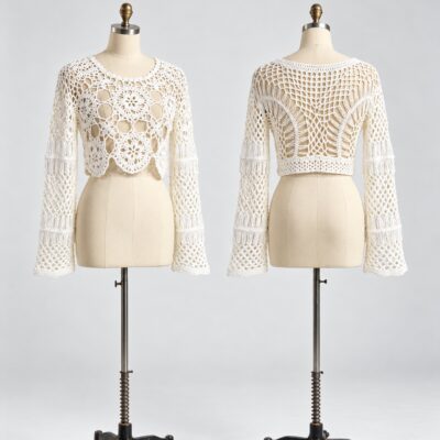 Front and back of an ivory floral crochet crop top with long flared sleeves, round neckline and openwork back